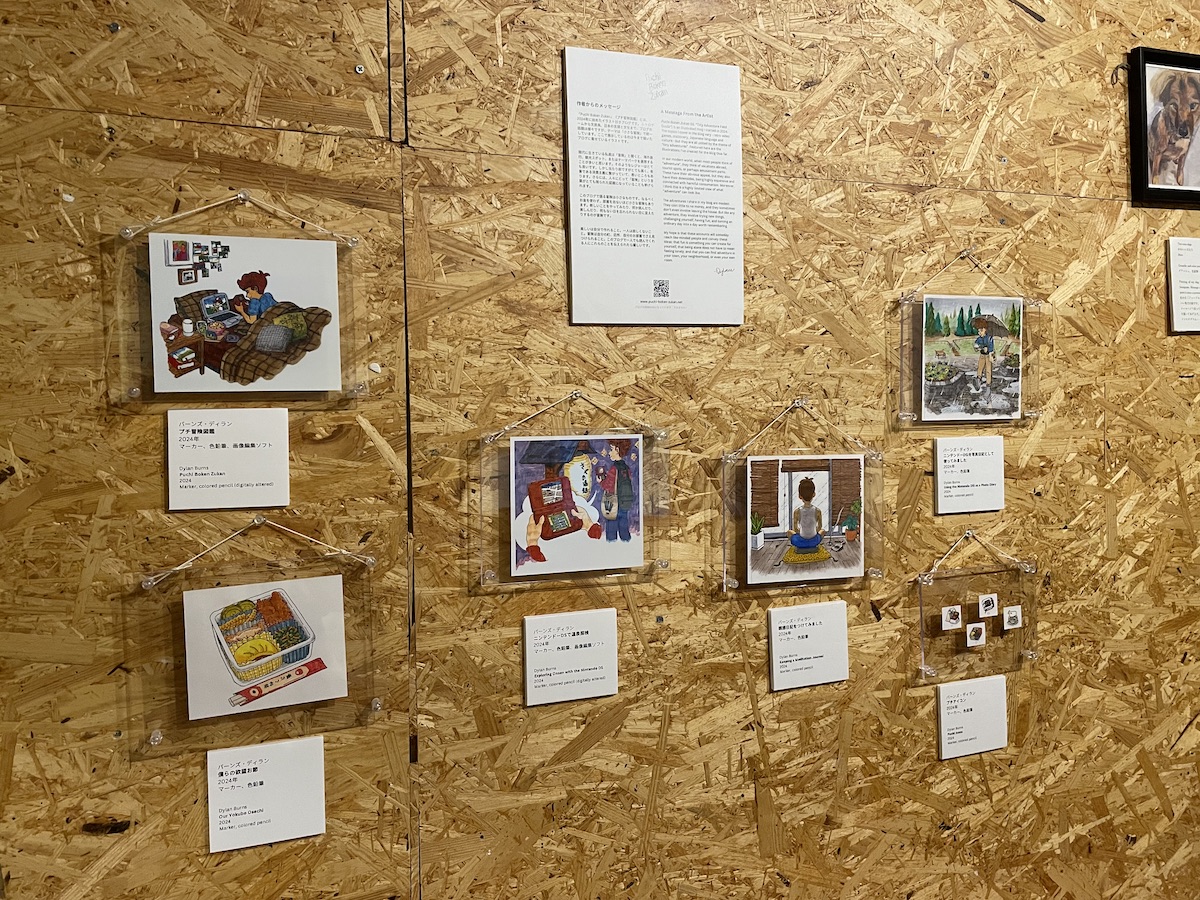 Illustrations from Puchi Boken Zukan on display in a gallery space